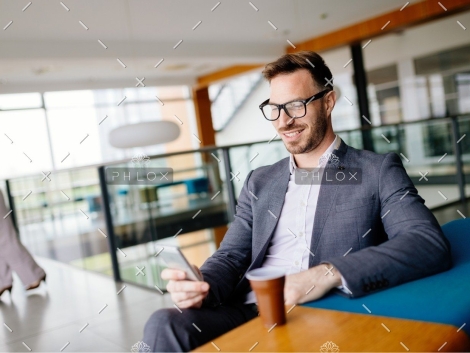 demo-attachment-2706-businessman-taking-a-break-with-a-cup-of-coffee-JW4B3DH