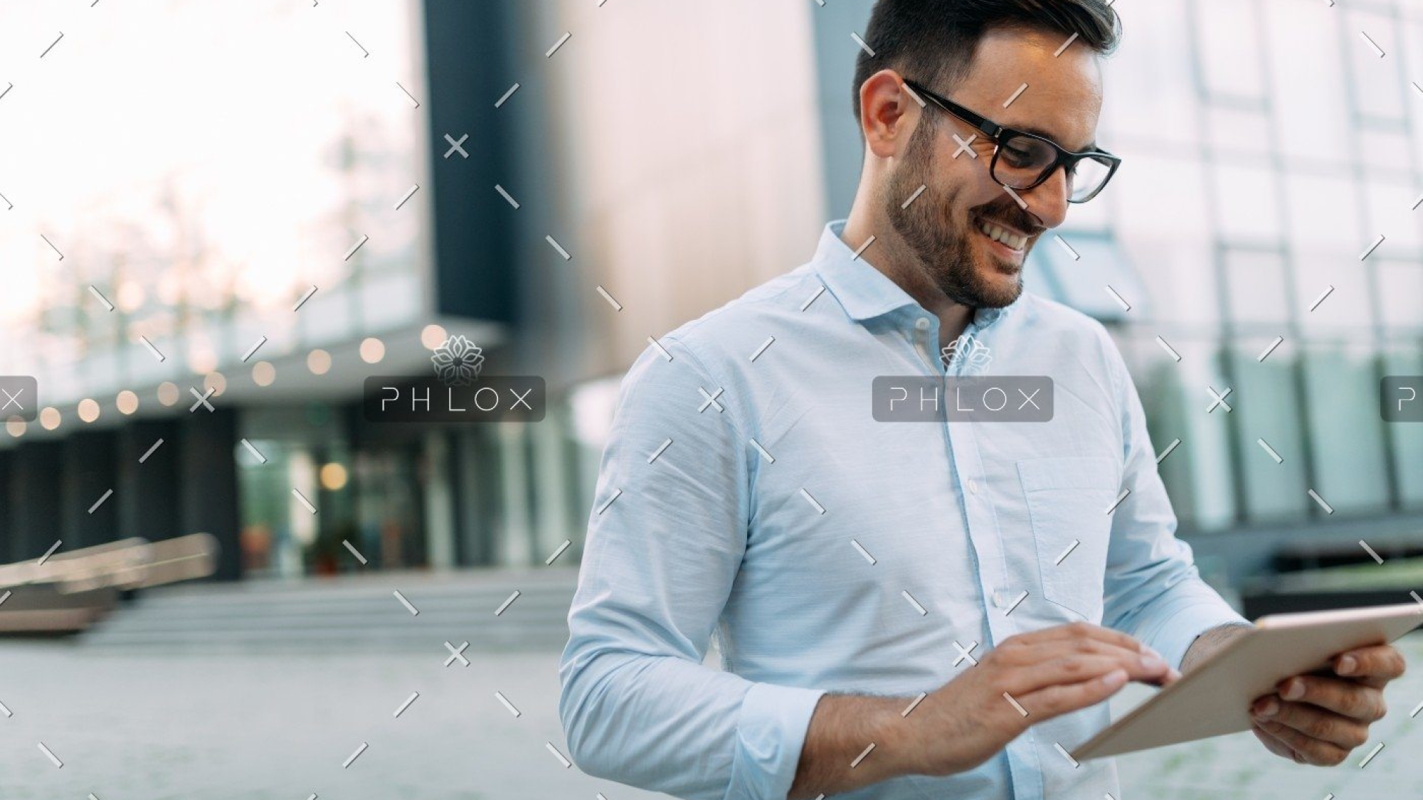 demo-attachment-2721-portrait-of-businessman-in-glasses-holding-tablet-AWVHCJU